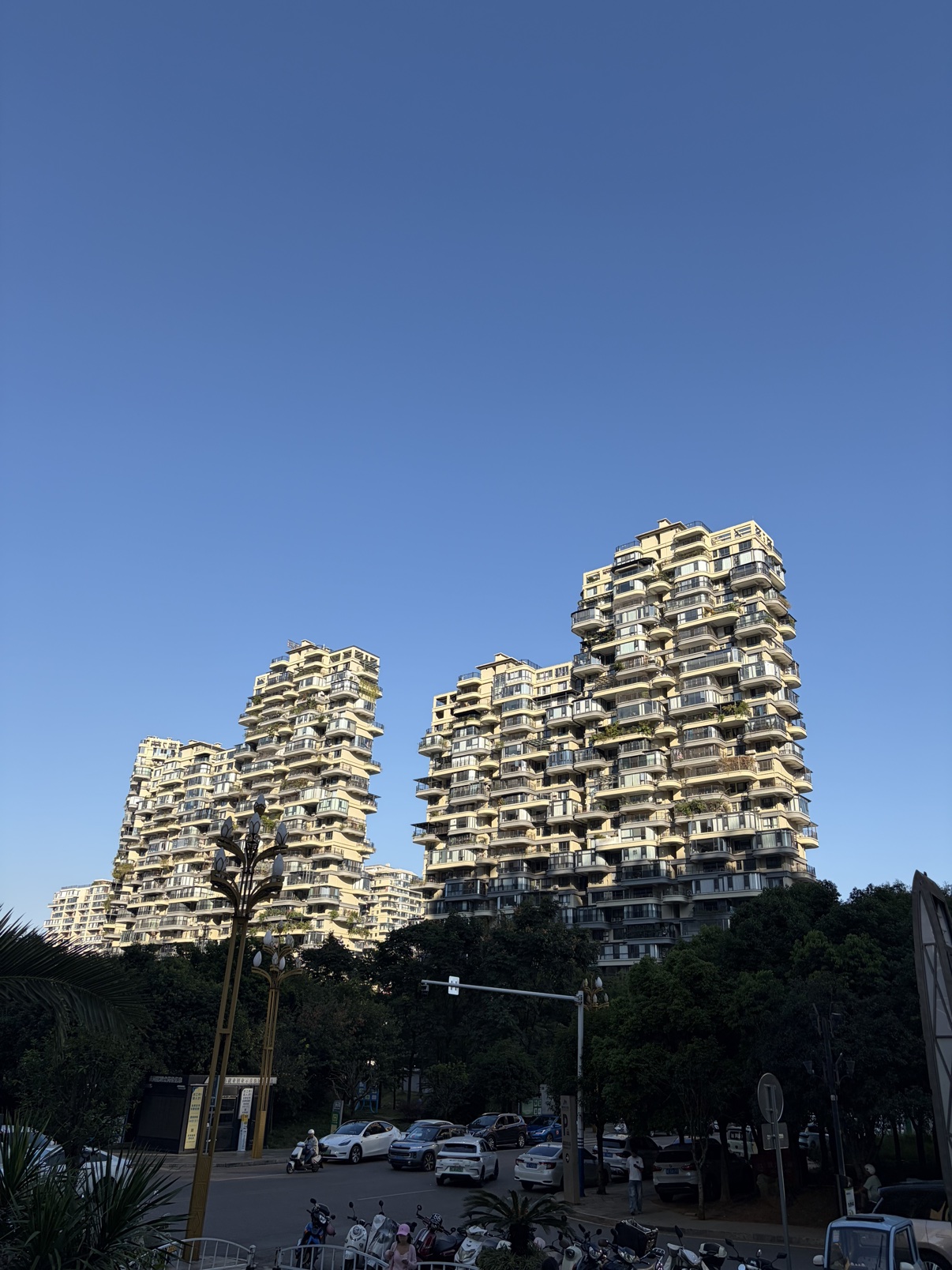 Residential buildings under clear blue autumn sky in Xingyi